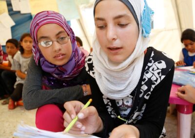 Two girls in  Lebanon tackling a maths question