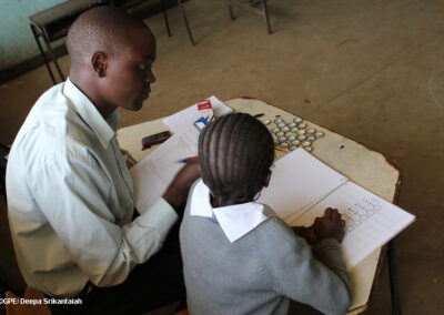 Teacher working with a primary pupil