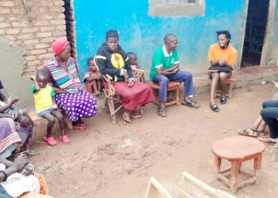 Teacher with parents at school in Uganda