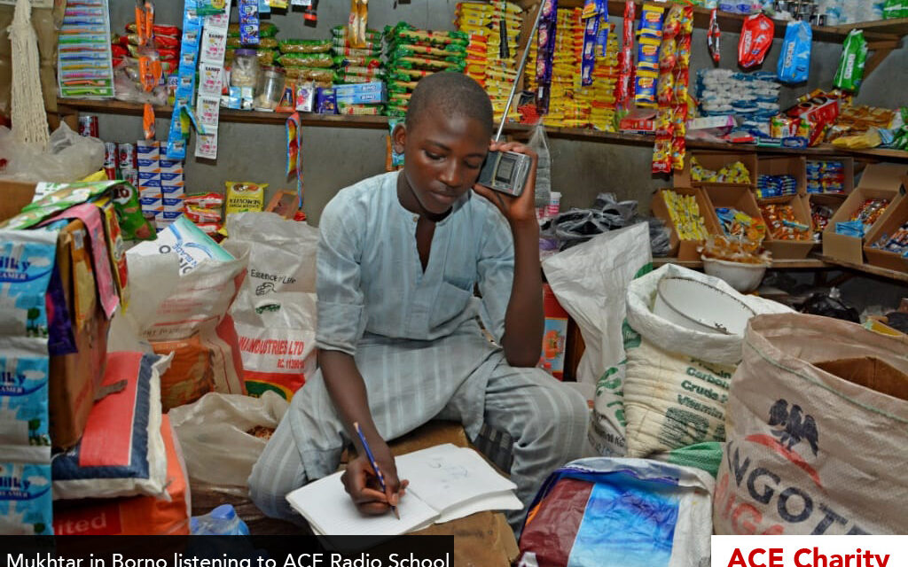 Boy doing school work listening to the radio