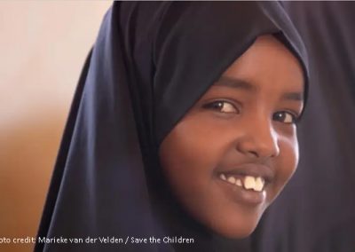 smiling girl wearing a headscarf