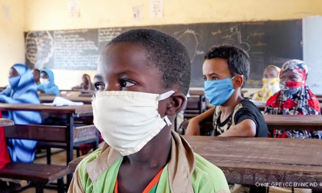 Primary age children in classroom in Niger, wearing masks