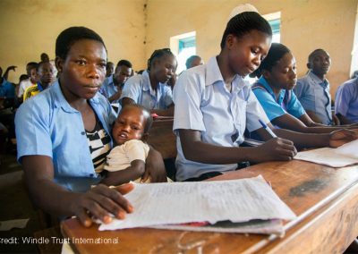 Female student attends catch-up classes with her baby