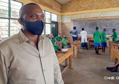 School representative wearing a face mask in the classroom, Rwanda 2021.