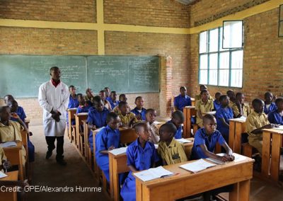 A teacher in a class of boys in Rwanda