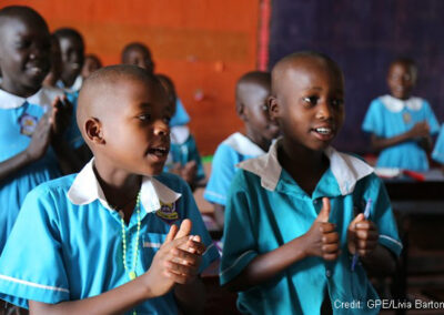 Children singing in the classroom of a primary school, Uganda