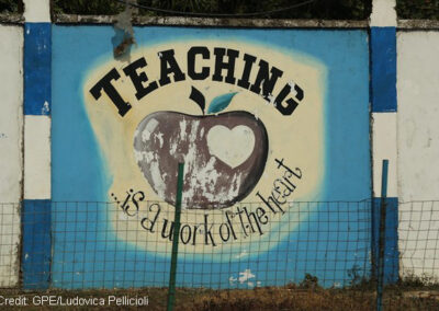 Sign reading ‘Teaching is a work of the heart’ on the wall of Freetown Teacher’s College, Sierra Leone.