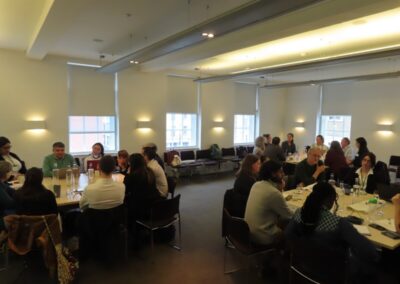 Three table groups of participants at the UKFIET and British Council workshop on language, held in London in March 2024.
