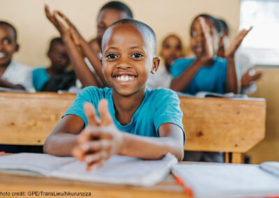 Close up of a girl clapping in class, Kamonyi, Rwanda