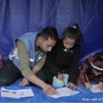 UNRWA staff provides psychosocial support to displaced girls through recreational activities in Al Mawasi area, west of Khan Younis, Middle Areas, Gaza.