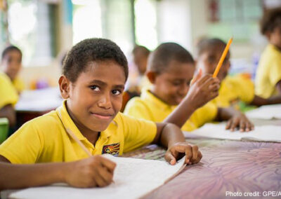 Students wearing yellow shirts in class, Vanuatu