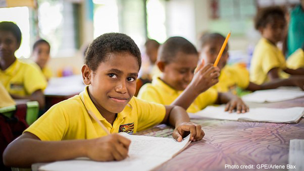 Students wearing yellow shirts in class, Vanuatu